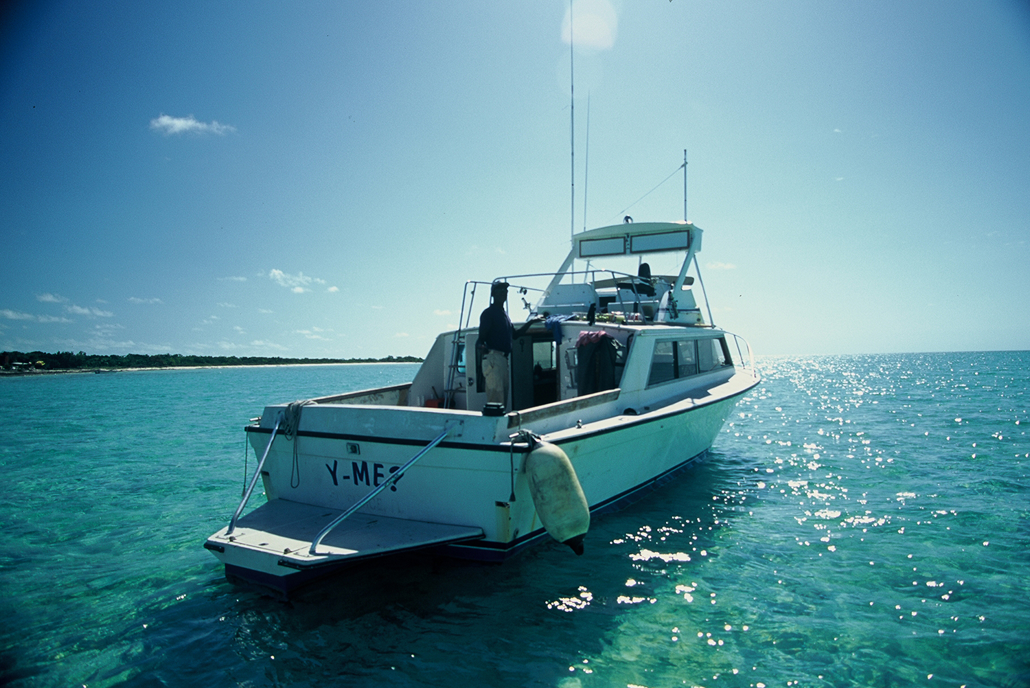 A color photograph of a boat in the Bahamas