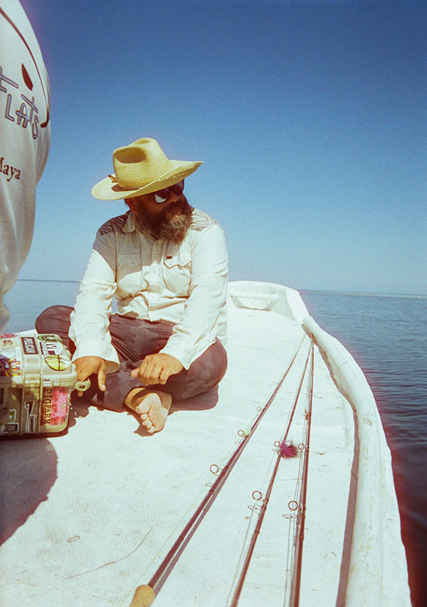 Johnson sits on the deck of a panga in the Yucatán. Photo: Justin Carfagnini